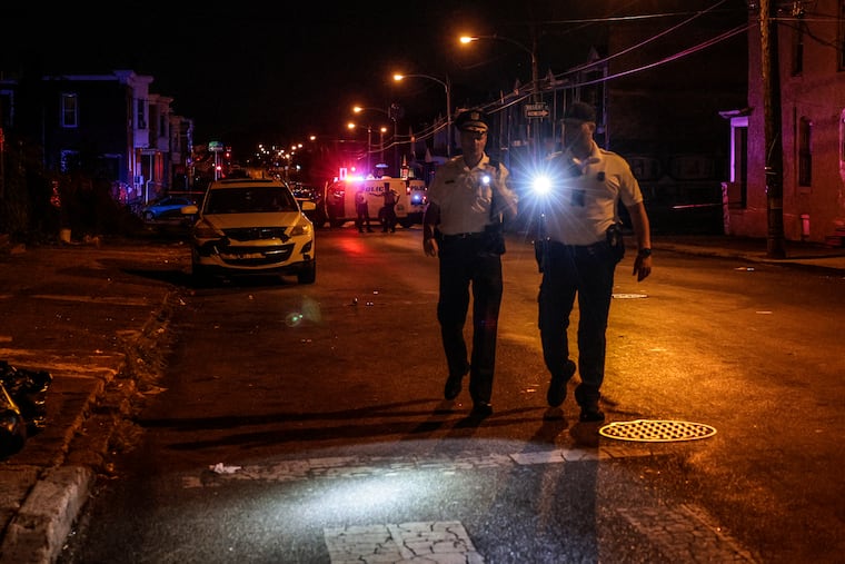 Police near 55th Street and Chester Avenue where a 32-year-old man was fatally shot Wednesday, Sept. 20, 2023.