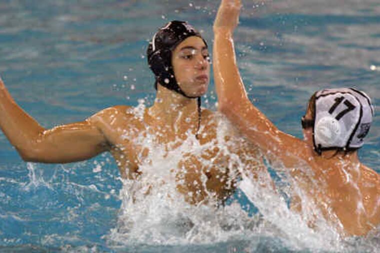 Episcopal Academy's Alberto Munarriz, an exchange student from Spain who plays the two-meter, or hole set, position, looks to pass while defended by the Hill School's Nick DiLeo. The schools are two of 16 in the area that play the sport in the fall.