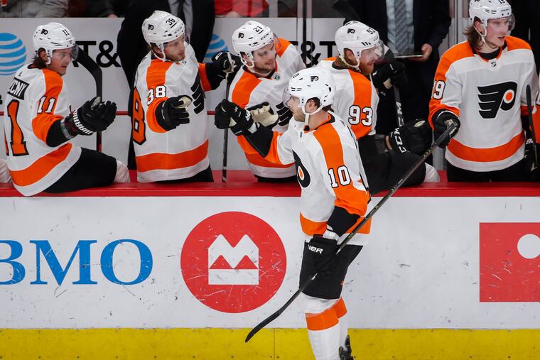 Philadelphia Flyers center Corban Knight (10) celebrates with teammates after scoring against the Chicago Blackhawks during the first period of an NHL hockey game Thursday, March 21, 2019, in Chicago. (AP Photo/Kamil Krzaczynski)
