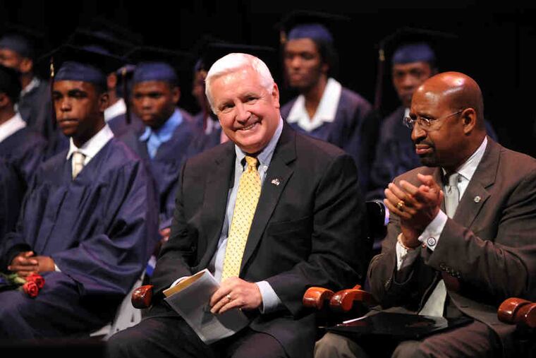 Mayor Nutter (right) and Gov. Corbett both spoke at the ceremony at the Zellerbach Auditorium at the University of Pennsylvania. Corbett told the graduates: "You now have an obligation to make this place known to the rest of the world."