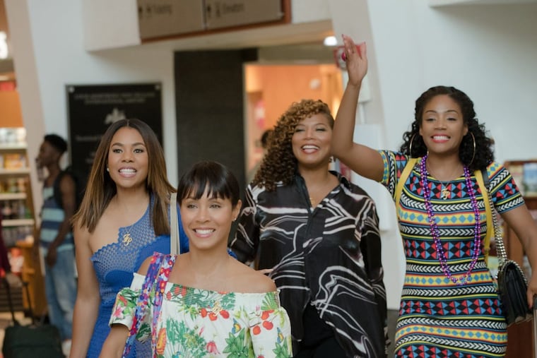 "Girls Trip": JADA PINKETT SMITH is Lisa (front), with (L to R) REGINA HALL as Ryan, QUEEN LATIFAH as Sasha, and TIFFANY HADISH as Dina. Four lifelong friends travel to New Orleans for the annual Essence Festival. (Photo Credit: Michele K. Short / Universal Studios)