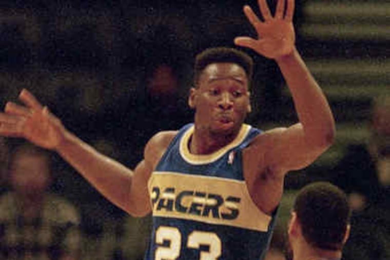 Mr. Tisdale in action for the Indiana Pacers in 1987, leaping in an effort to block a pass by Golden State's Greg Ballard.