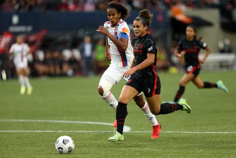 Portland Thorns striker Sophia Smith (right), a likely future starter for the U.S. national team, battled repeatedly against Lyon's star French centerback Wendie Renard in the final of the Women's International Champions Cup.
