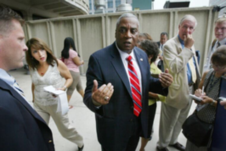 Police Commissioner Sylvester Johnson speaks with reporters yesterday outside Police Administration Building.