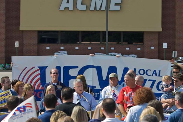 Local 1776 chief Wendell Young 4th (at microphone) with members of the United Food and Commercial Workers union, in 2009. (File photo)