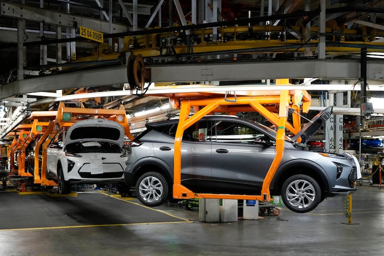 FILE - Vehicles move along the 2023 Chevrolet Bolt EV and EUV assembly line at the General Motors Orion Assembly June 15, 2023, in Lake Orion, Mich.