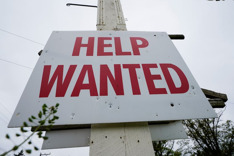 A help wanted sign is posted in Lansdale in this April 2023 photo.