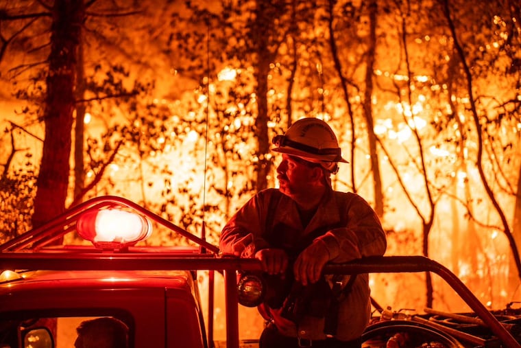 An unnamed firefighter on scene at the Allen Road Wildfire in Bass River State Forest, in Burlington County, NJ, in photo supplied by the N.J. Department of Environmental Protection.