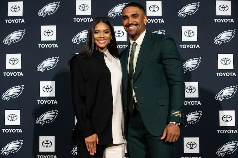 Bryonna “Bry” Burrows and Philadelphia Eagles quarterback Jalen Hurts pose for a photo.