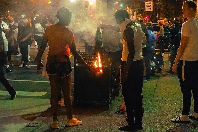 In this photo provided by instagram account of @mckinley_moore, demonstrators gather in downtown Louisville to protest the killing of Breonna Taylor.