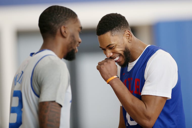 The Sixers' Glenn Robinson III (right) with teammate Shake Milton at practice Feb. 19.