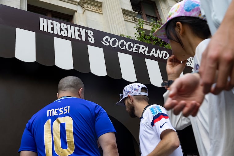 Soccer fans enter Hershey’s Soccerland pop-up event at Dilworth Park on Thursday.