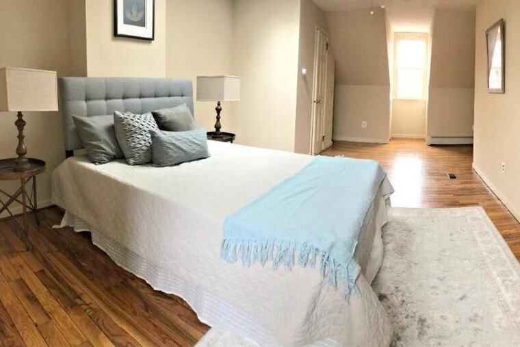 The 1,746-square-foot property includes three bedrooms: two on the second floor that share a full bath and a third-floor bedroom with a powder room.