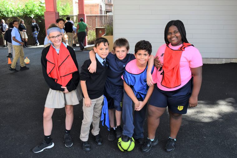 Students at La Salle Academy show off the school's new outdoor space and rooftop area.