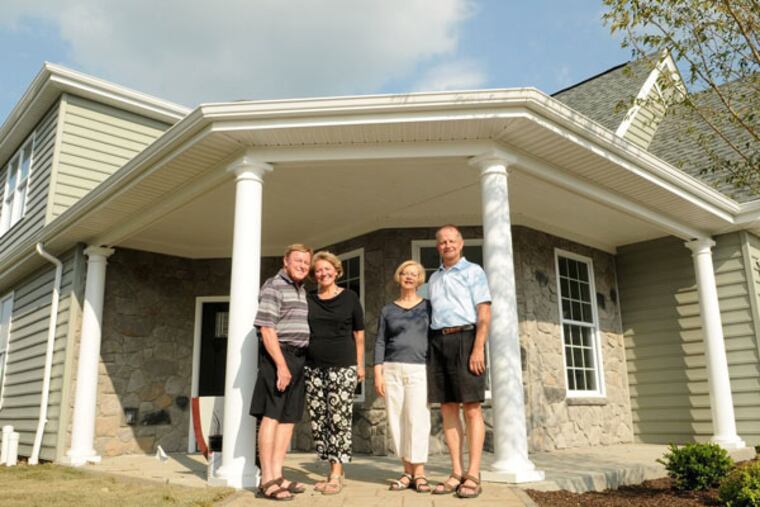 From left, John and Judy Woffington join Rich and Kathy Jucha outside a model home in a Traditions of America housing development called Sewickley Ridge in Ohio Township, Pa., on June 24, 2014. (Connor Mulvaney/Pittsburgh Post-Gazette/MCT)