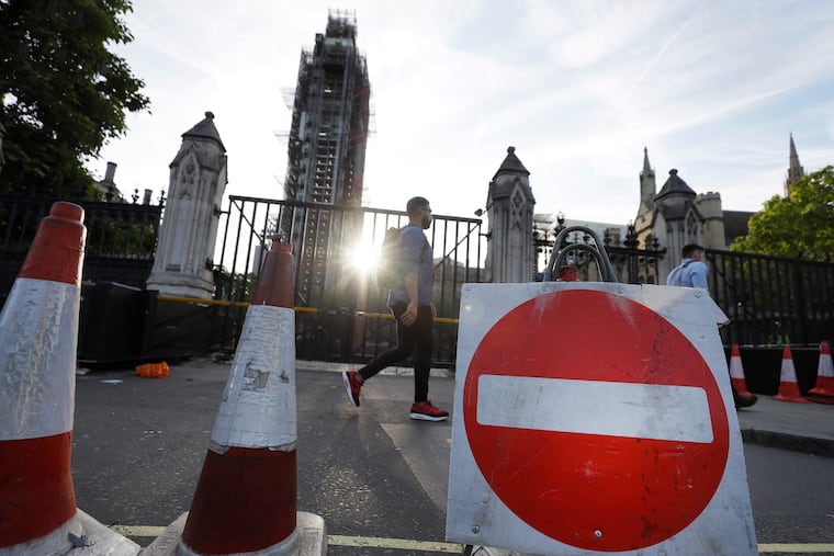 A no-entry road sign sits in front of the entrance to Britain's Parliament in London on Thursday.