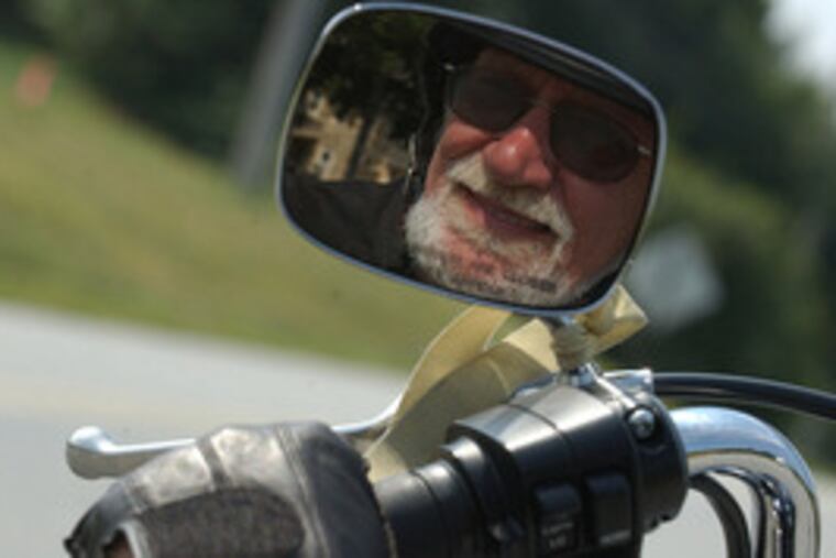 William J. "Stretch" Smaltz of Honey Brook, reflected in his 1995 Harley's mirror in 2005.