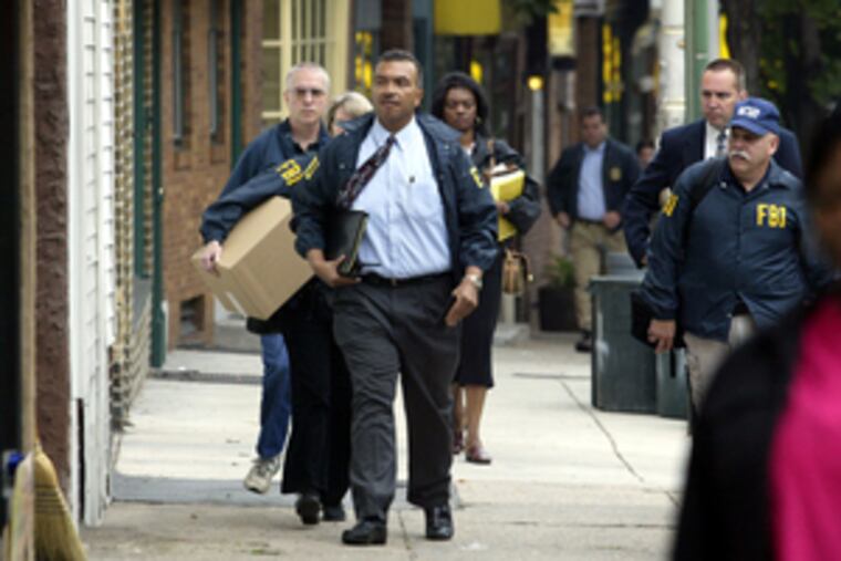 FBI agent Jesse Coleman (center) is joined by colleagues during the 2003 investigation into imam Shamsud-din Ali. Coleman, who handled many risky and high-profile cases, retired after 28 years.