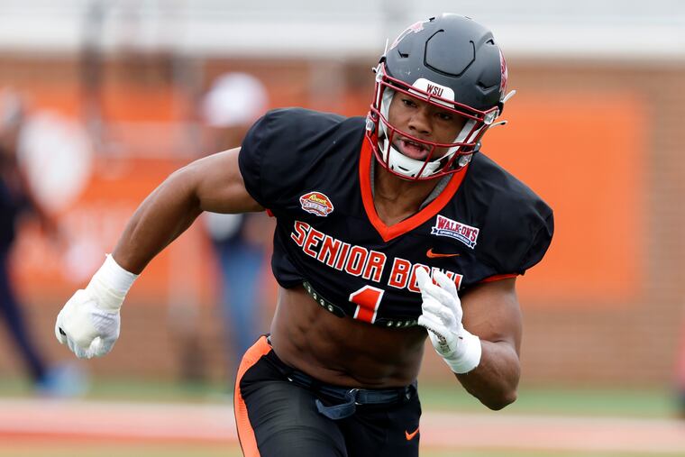 National linebacker Daiyan Henley of Washington State runs drills during practice for the Senior Bowl NCAA college football game Wednesday, Feb. 1, 2023, in Mobile, Ala.. (AP Photo/Butch Dill)