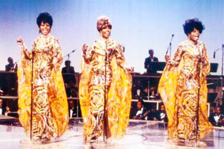 The Supremes in their divine gowns.