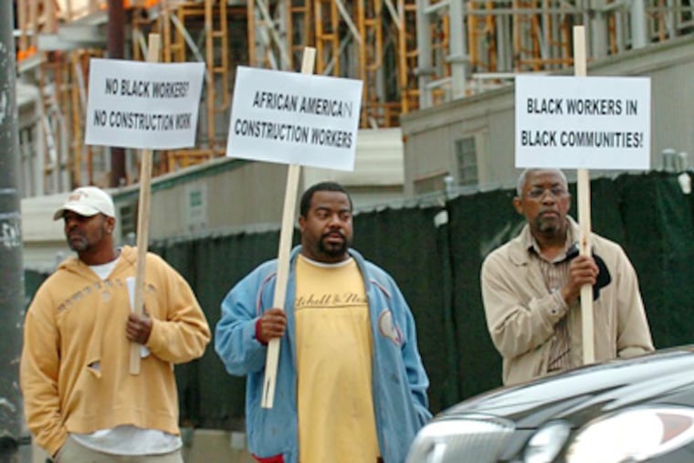 Calling for more hiring of African American contractors and laborers, several dozen protesters blocked intersections around the construction site for the expansion of the Convention Center. (Clem Murray / Staff Photographer)