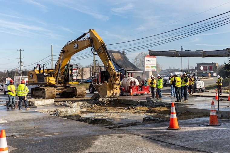 Construction crews work on a sinkhole that closed southbound 202 in King of Prussia on Saturday.