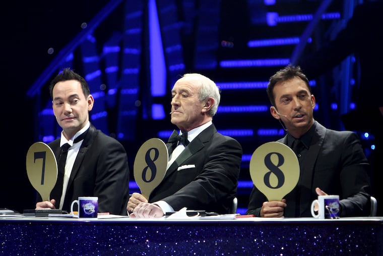 From left, judges Craig Revel Horwood, Len Goodman and Bruno Tonioli gesture, during the final dress rehearsal for the opening of the 'Strictly Come Dancing Live Tour' at the NIA, Birmingham, England, in 2012.