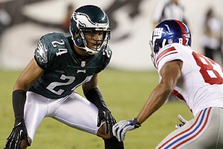 Nnamdi Asomugha defends the Giants' Domenik Hixon on Sunday night. (Yong Kim/Staff Photographer)