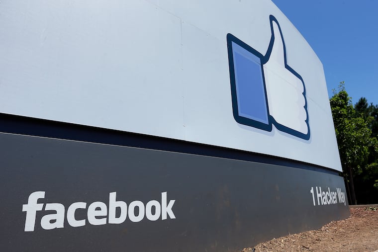 File photo shows a sign at Facebook headquarters in Menlo Park, Calif. The Washington Post reports that regulators are planning a record fine for violations relating to failure to protect users' personal data. (AP Photo/Ben Margot)