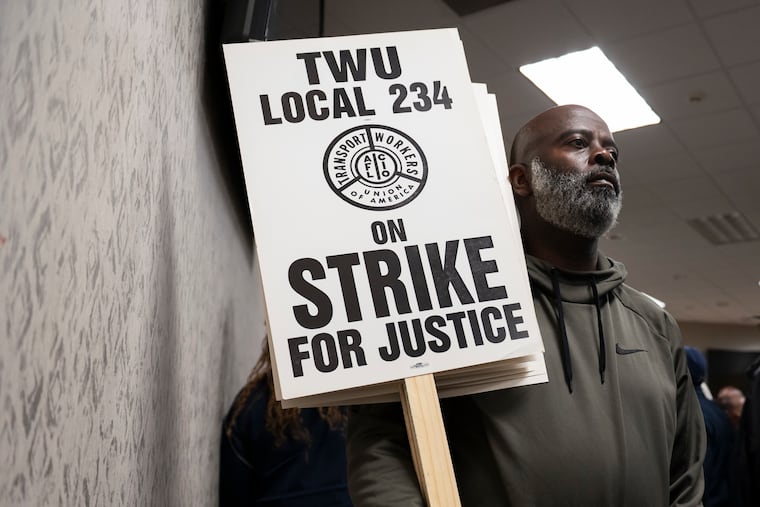 SEPTA bus driver Morris Aikens holds a picket sign at the TWU Local 234 in Northern Liberties on Nov. 4, 2024. For the fourth year in a row, transit workers in the union have voted to authorize a work stoppage if a contract deal cannot be reached.