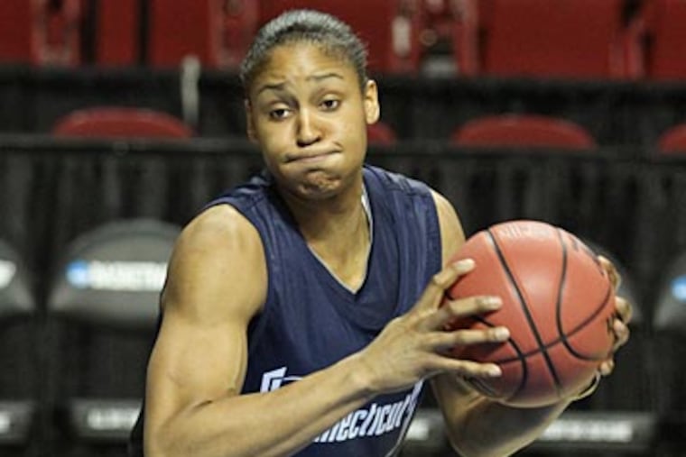 UConn's Maya Moore works on her pivot skills during a practice session. (Michael Bryant/Staff Photographer)