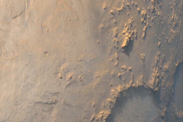 The "Happy Face Crater" was photographed by a Mars orbiter in 1999.