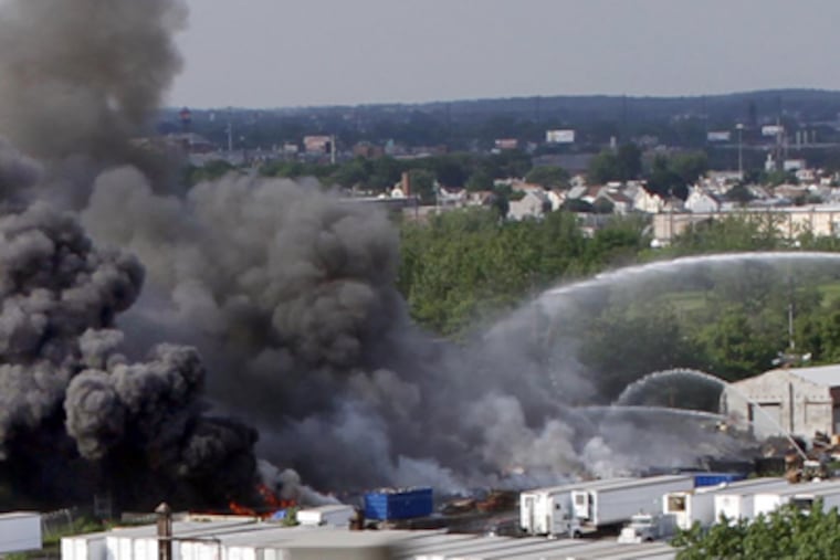 Plumes of black smoke from a three-alarm blaze Wednesday in Bridesburg could be seen for miles. (Laurence Kesterson / Staff Photographer)