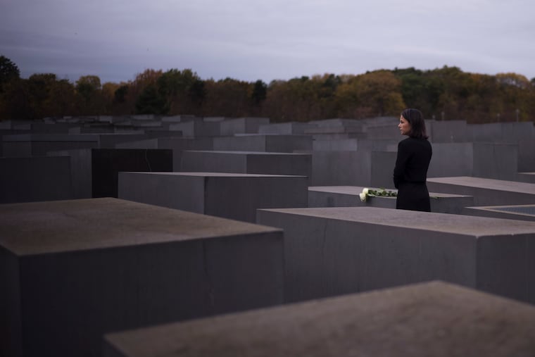 Annalena Baerbock places flowers at Berlin's Memorial to the Murdered Jews of Europe on the 85th anniversary of the November 1938 pogroms in Germany and Austria, in 2023.