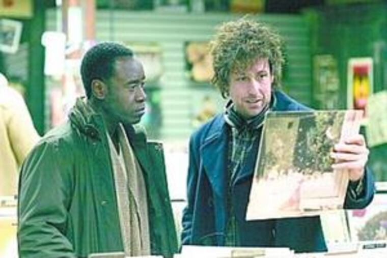 Don Cheadle (left) portrays Adam Sandler's college roommate.
