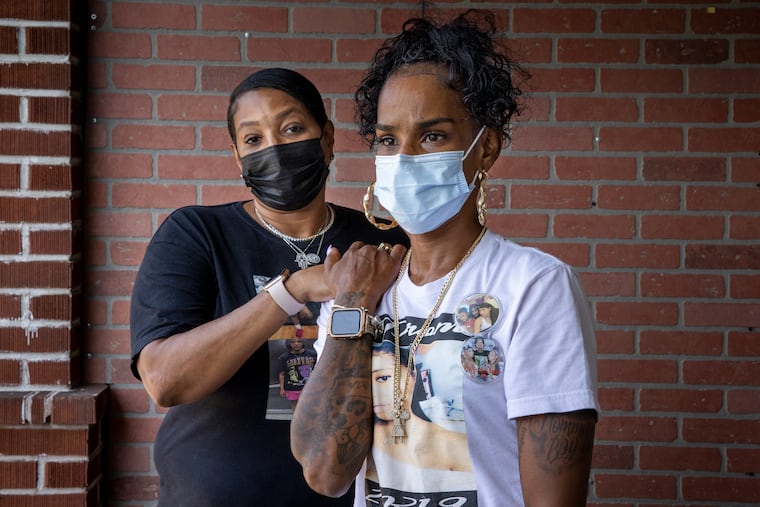 A year ago, Tiffaney Flynn (right) helped Karen Robinson (left) through unimaginable pain after her daughter Jasmine Lewis was killed by a stray bullet while driving. A year later, Robinson is comforting Flynn after her daughter was shot multiple times last week while sitting in a car outside a ShopRite. This weekend, the two mothers will stage a ride/march to demand justice for their daughters. The women were photograph taken at Flynn's home in Philadelphia on Wednesday, Aug. 25, 2021.