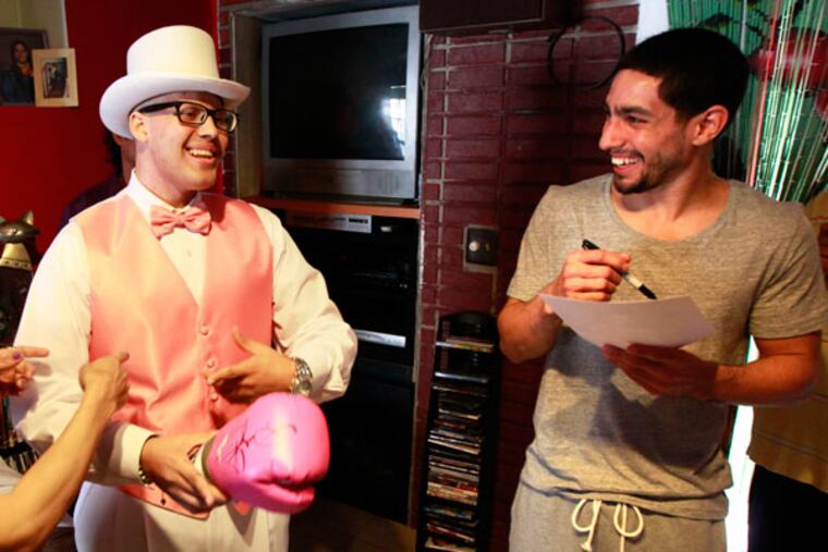 Danny Garcia will be presents Darnel Baez, 17, with a gift. Garcia is the current WBA/WBC and Ring Magazine super lightweight world boxing champion. Baez is a Latino male, who is diagnosed with stage 4 Lukemia, April 19, 2013. (David Swanson/Staff Photographer)