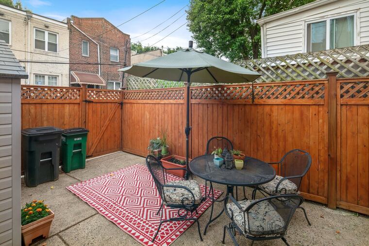 From their cedar fence-enclosed backyard, owners of this South Philly house can hear the Phillies crowd at Citizens Bank Park.
