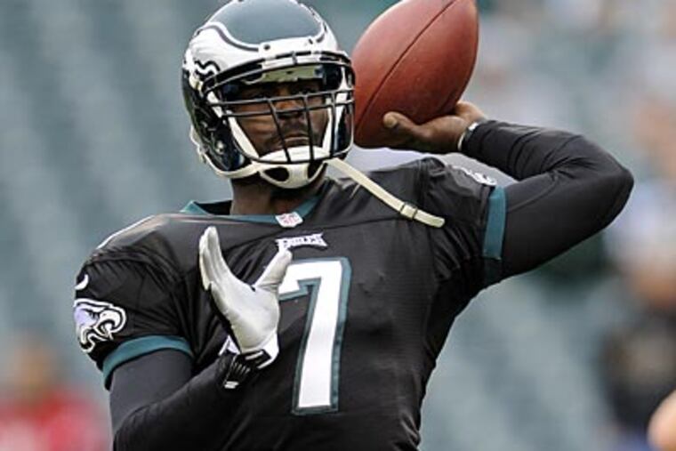 Neither Michael Vick nor Nick Foles have been told that they are reversing jobs, sources say. (Michael Perez/AP)