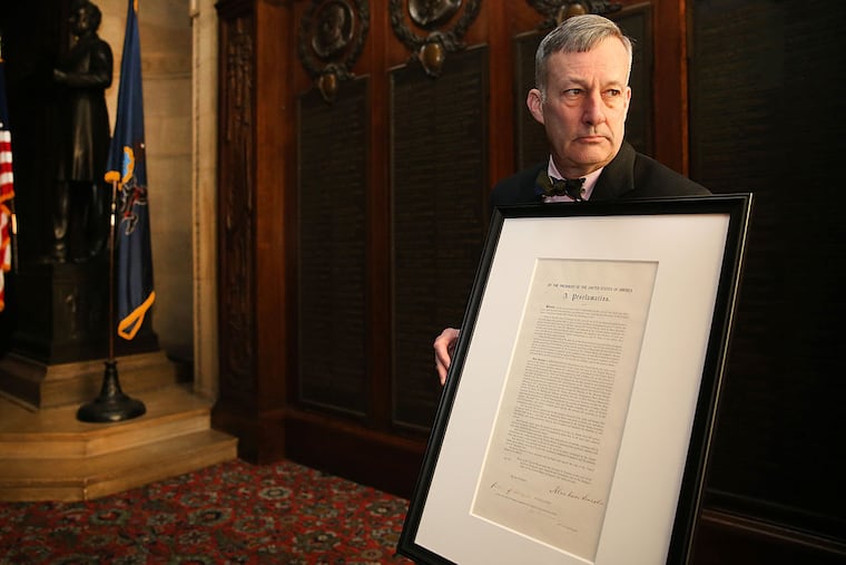 Jim Mundy, Union League director of education and programming, displays items from the vault. He will speak at a tour guides’ conference this weekend.