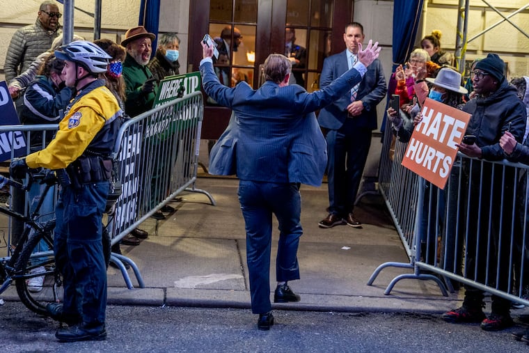 Guests interact with protesters outside the Union League as they arrive Tuesday, Jan. 24, 2023, for ceremonies for Florida Gov. Ron DeSantis as he is honored with the group’s highest honor — a gold medal first awarded to President Abraham Lincoln in 1863.