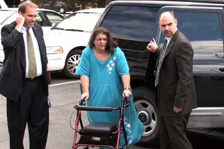 Michele Cossey of Plymouth Meeting appears at her arraignment this morning in Conshohocken. She was charged this morning with several felonies, including unlawful transfer of firearms and aiding the possession of a firearm by a minor.