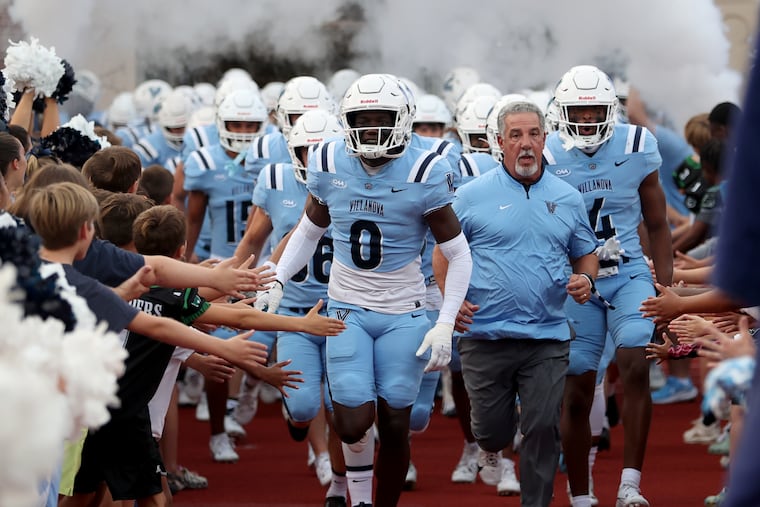 Villanova head coach Mark Ferrante (center) will lead the Wildcats in the second round of the FCS playoffs against Youngstown State this Saturday.