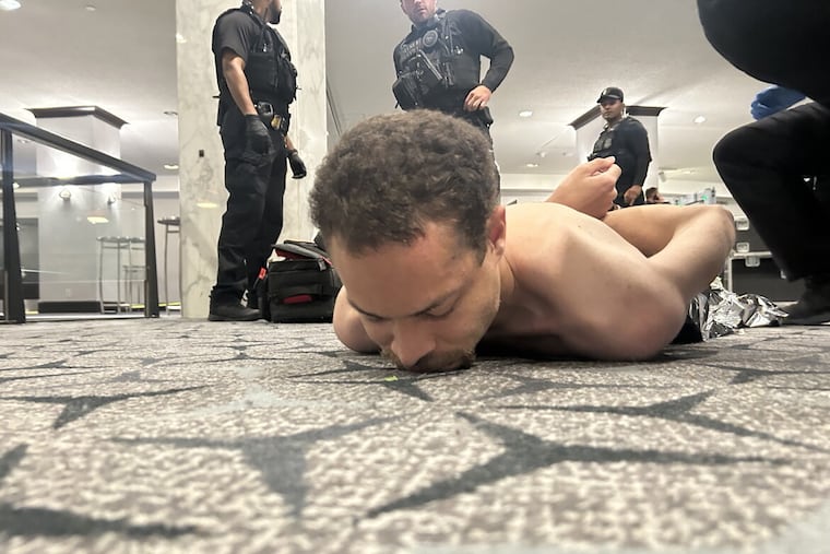 In an image posted by President Donald J. Trump on Truth Social, law enforcement detain a suspect, later identified as 31-year-old Cole Thomas Allen, following a shooting at the White House Correspondents' Dinner, on Saturday, April 25, 2026.
