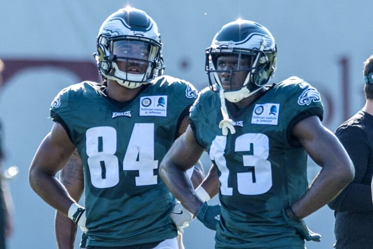 Eagles wide receivers Marcus Johnson (left) and Nelson Agholor wait to participate in drills during training camp August 1, 2017. CLEM MURRAY / Staff Photographer