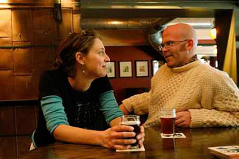 Leigh Maida and Brendan Hartranft, at Local 44, one of three bars they own that were raided by state police. (David Maialetti / Staff / File)