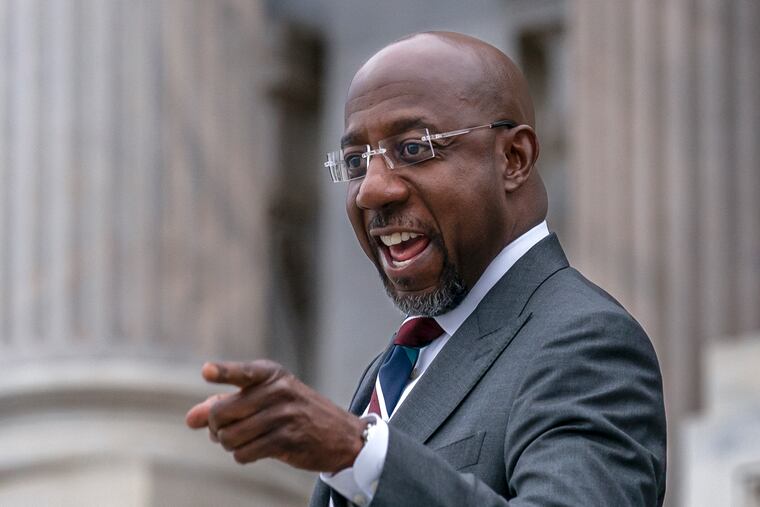 Sen. Raphael Warnock, D-Ga., arrives at the U.S. Capitol after defeating Republican challenger Herschel Walker in a runoff election in Georgia Tuesday.