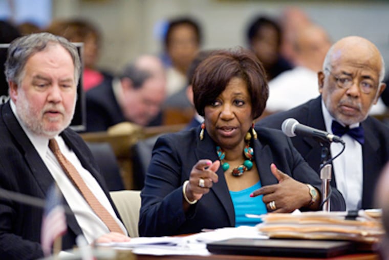 Flanking Arlene Ackerman are Michael Masch, chief financial officer for the school district, left, and School Reform Commission chairman Robert Archie. (Clem Murray / File)