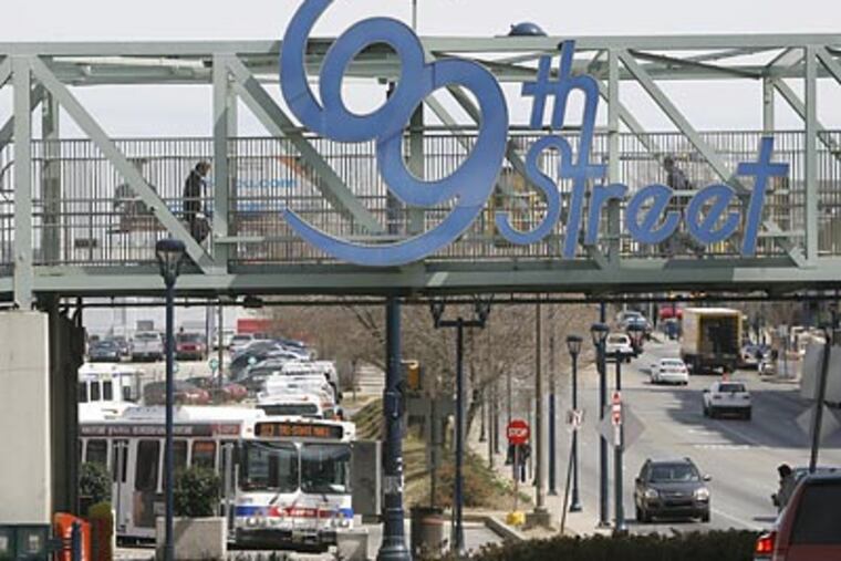 A sign trumpets the dozen blocks around 69th and Market Streets, long Philadelphia's alternative downtown. (Charles Fox/Staff Photographer)
