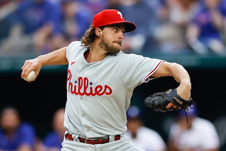 Aaron Nola pitches on opening day. He gave up five earned runs in 3⅔ innings against the Rangers.